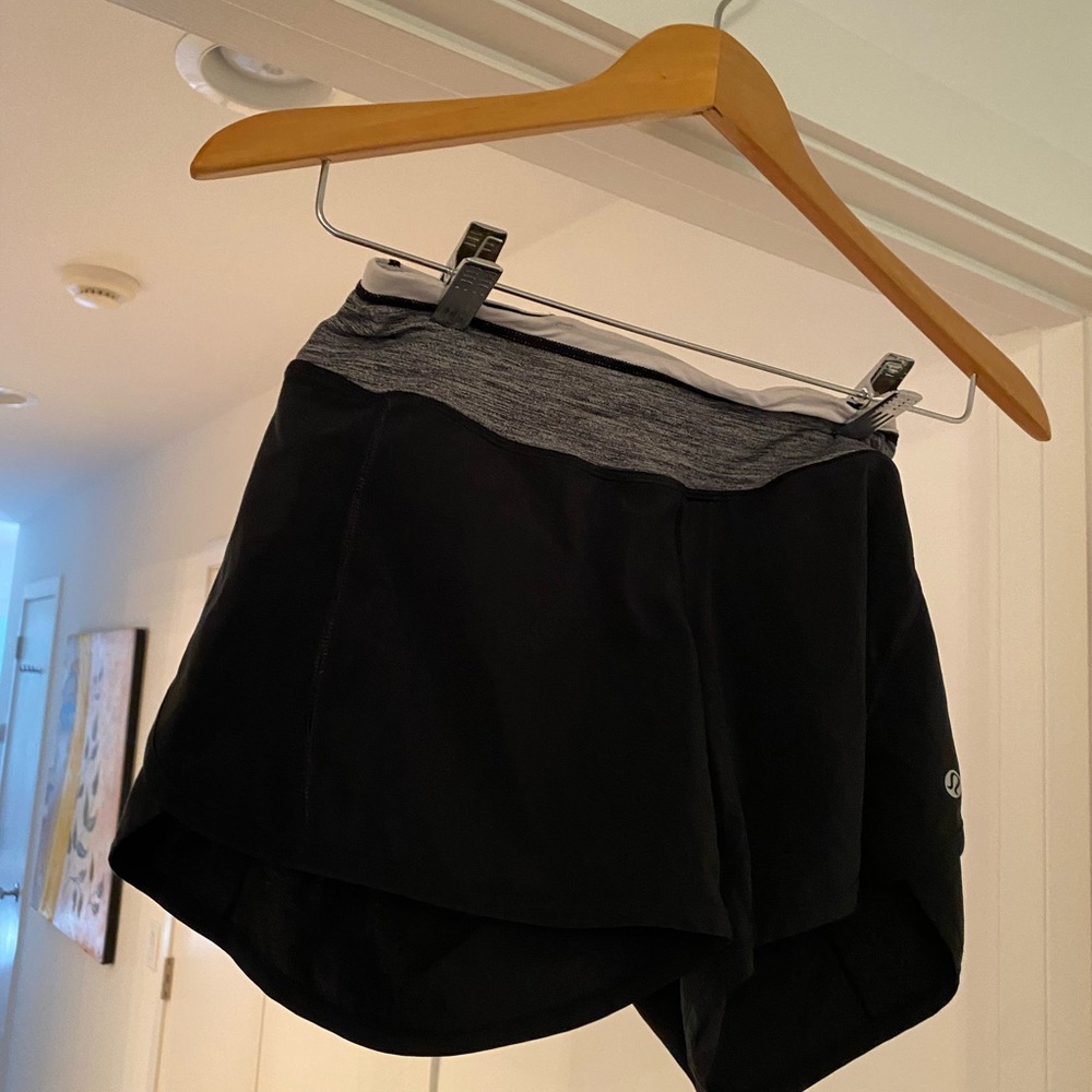 Lululemon shorts with pink/grey trim. Size 4